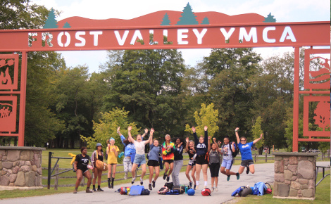 Cheering campers by Frost Valley YMCA entrance sign